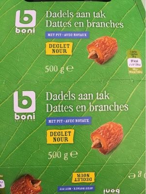 Image descriptive de Dattes en branches